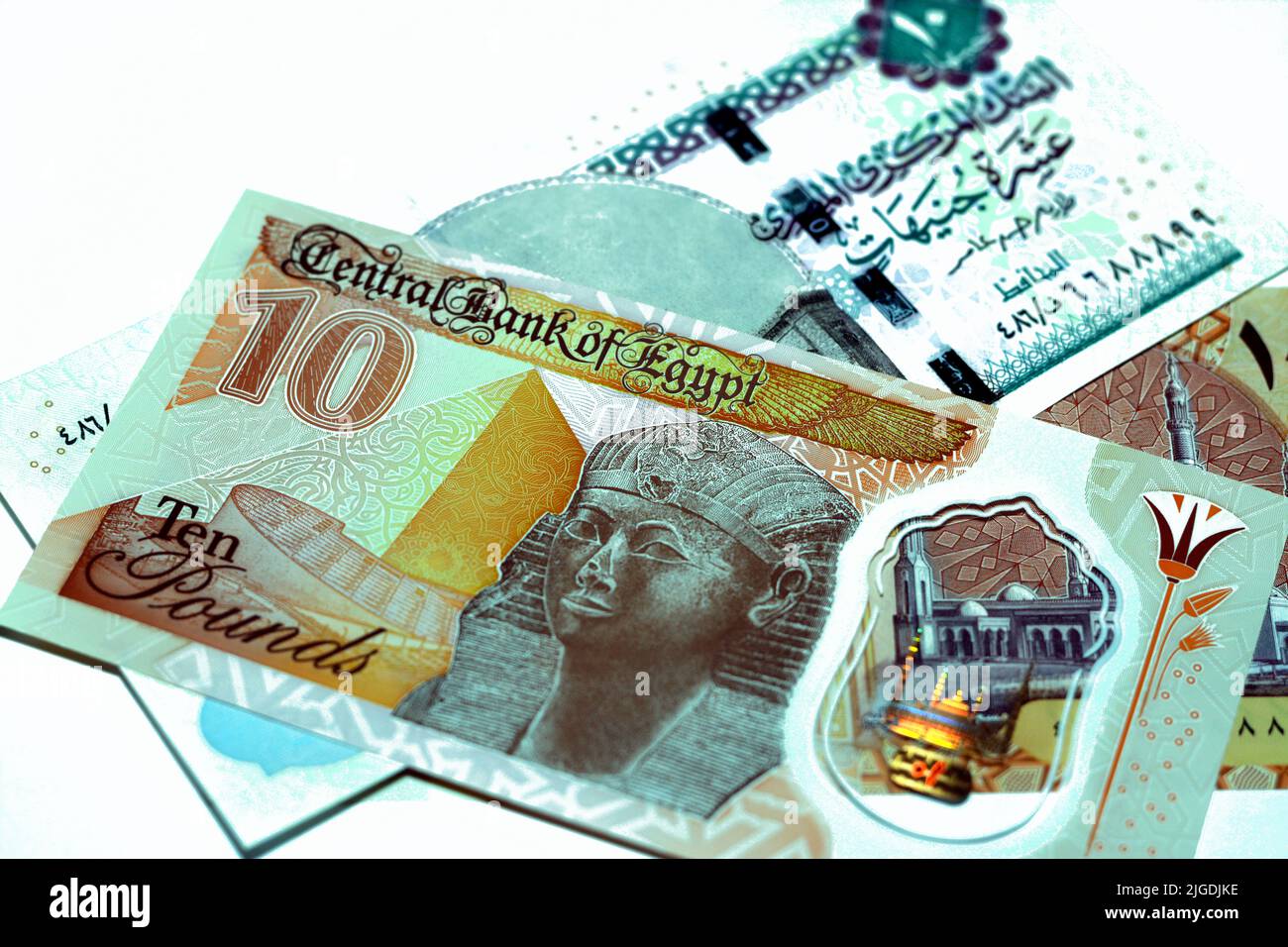 The new first Egyptian 10 LE EGP ten pounds plastic polymer banknote features Al-Fattah Al-Aleem mosque, Hatshepsut and pyramid with the old paper 10 Stock Photo
