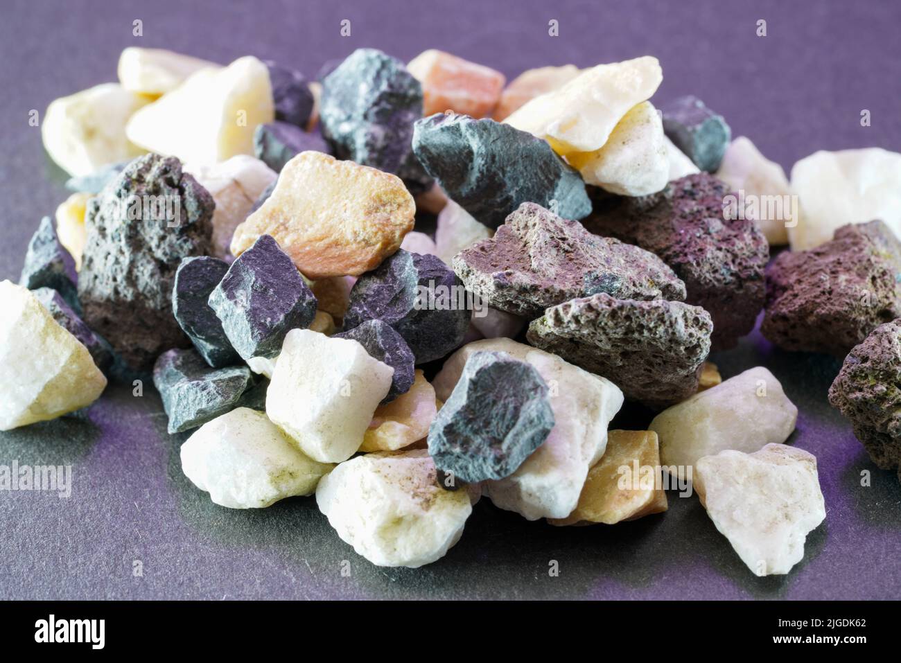 Granites are coarsely crystalline plutonic rocks rich in quartz and feldspar, but also contain