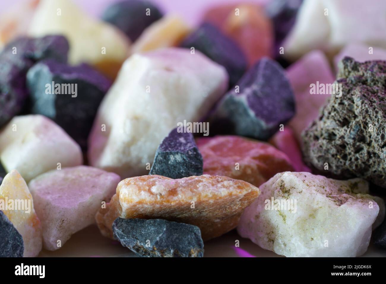 Granites are coarsely crystalline plutonic rocks rich in quartz and feldspar, but also contain