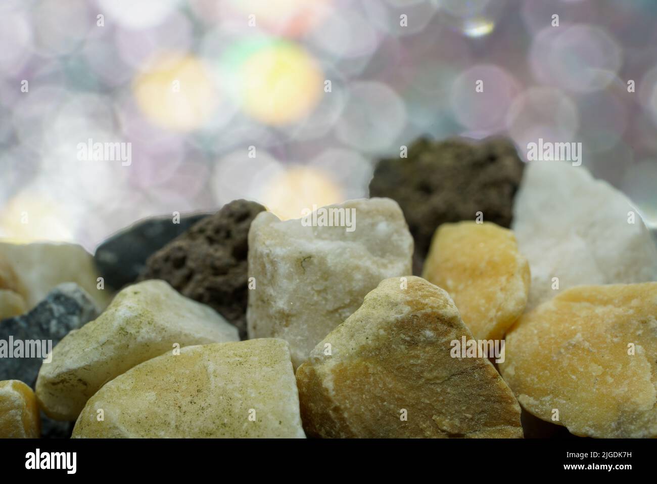 Granites are coarsely crystalline plutonic rocks rich in quartz and feldspar, but also contain