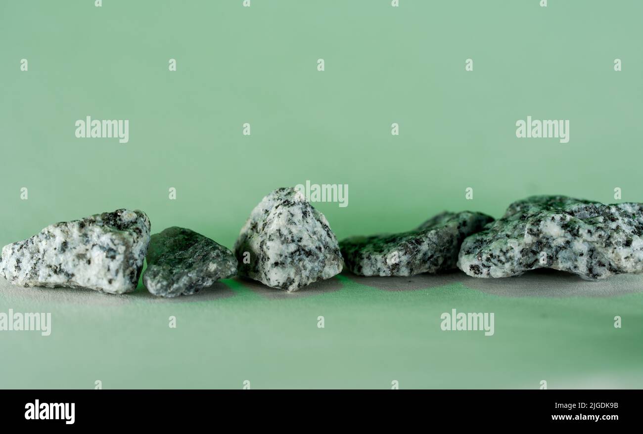 Granites are coarsely crystalline plutonic rocks rich in quartz and