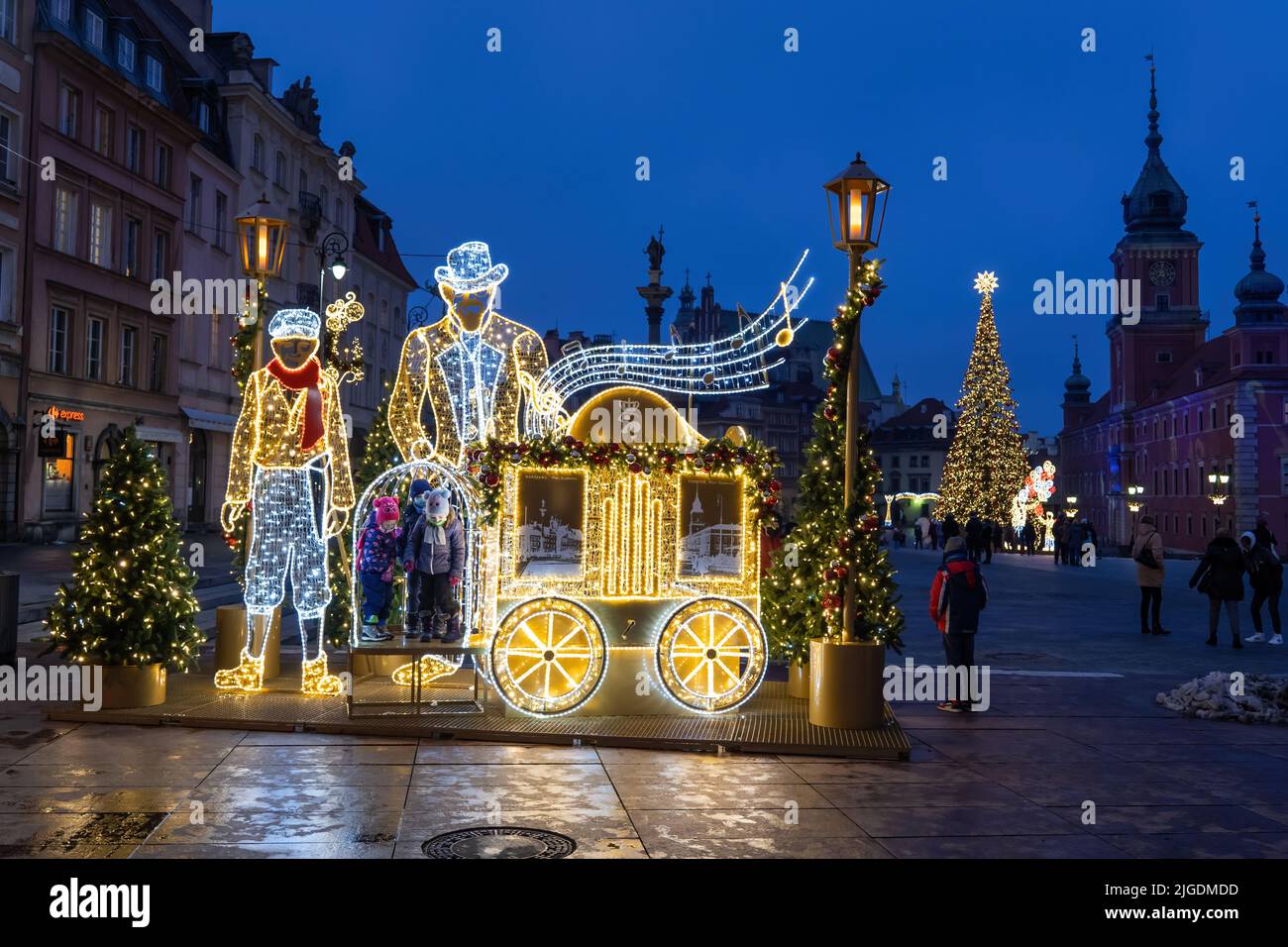 Winter holiday illuminated installation at night with place for children on square in the Old Town of Warsaw city during Christmas time in Poland. Stock Photo