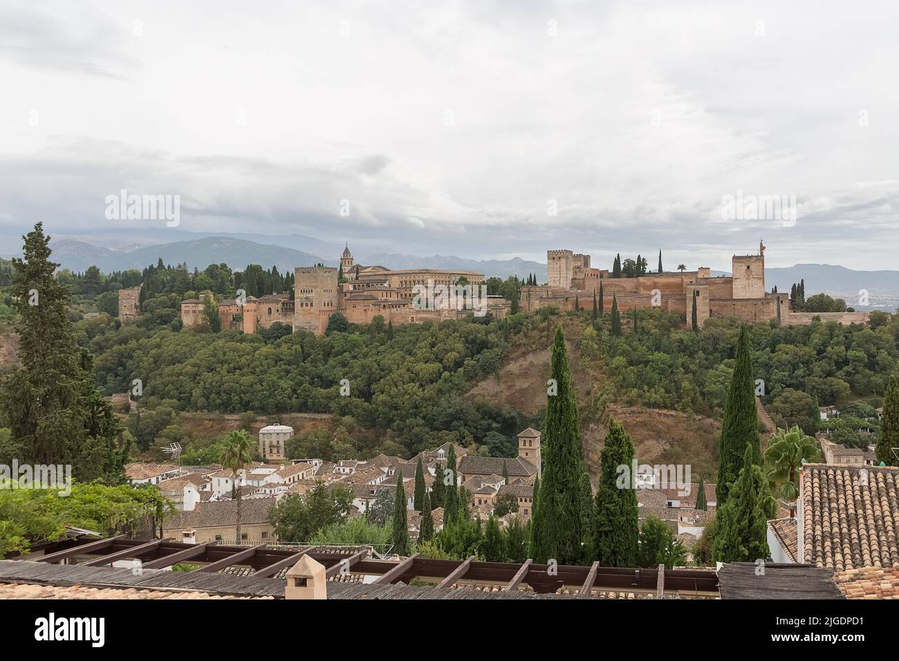 Alhambra Granada Spain - 09 14 2021: View at the exterior facade building at the Alhambra citadel and gardens, view Viewpoint San Nicolás, a palace an Stock Photo