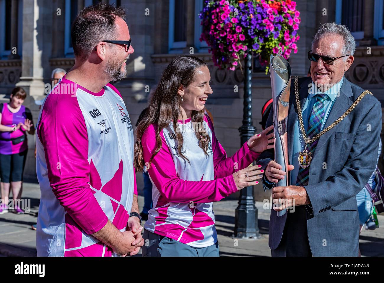 Northampton 10th July 2022. Commonwealth Games Queen’s Baton Relay going through the town centre with  left to right Jonathan Holmes, Chloe Birch and Dennis Meredith, while on it’s way to the The Birmingham 2022 Commonwealth Games.  Credit: Keith J Smith./Alamy Live News. Stock Photo