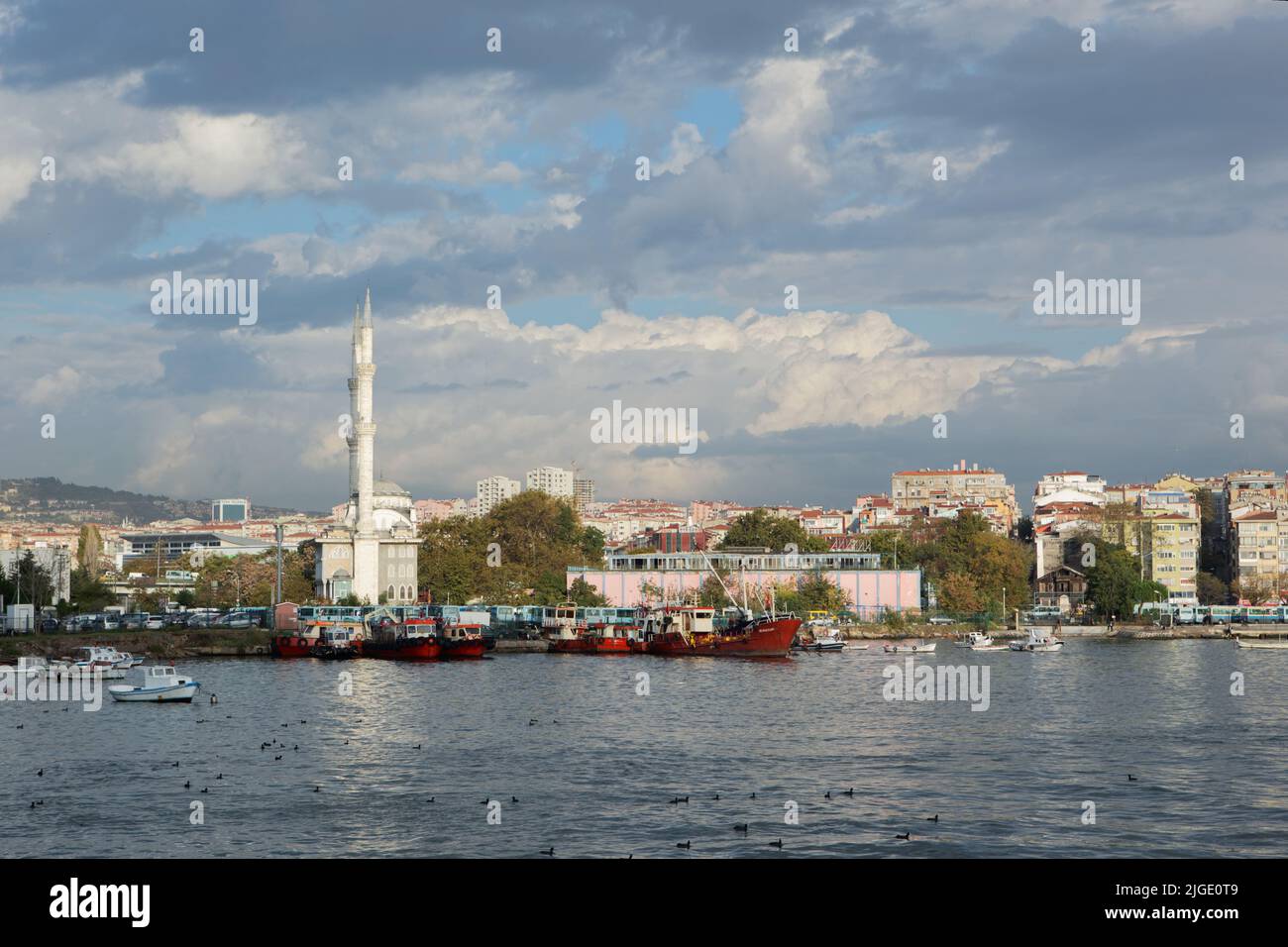 View to Kadikoy quay, Haydarpasa mosque, and Kadikoy district of Istanbul city, Turkey, from the Bosporus strait Stock Photo