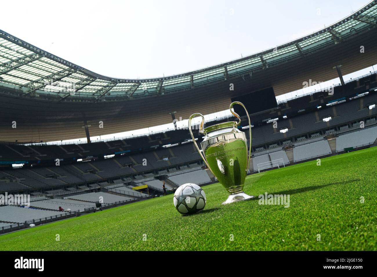 winner's trophy and official match ball by Adidas for the final of the UEFA  Champions League 2022 in Stade de France, Paris, France. inscribed with the  words 'мир | PEACE' Stock Photo - Alamy