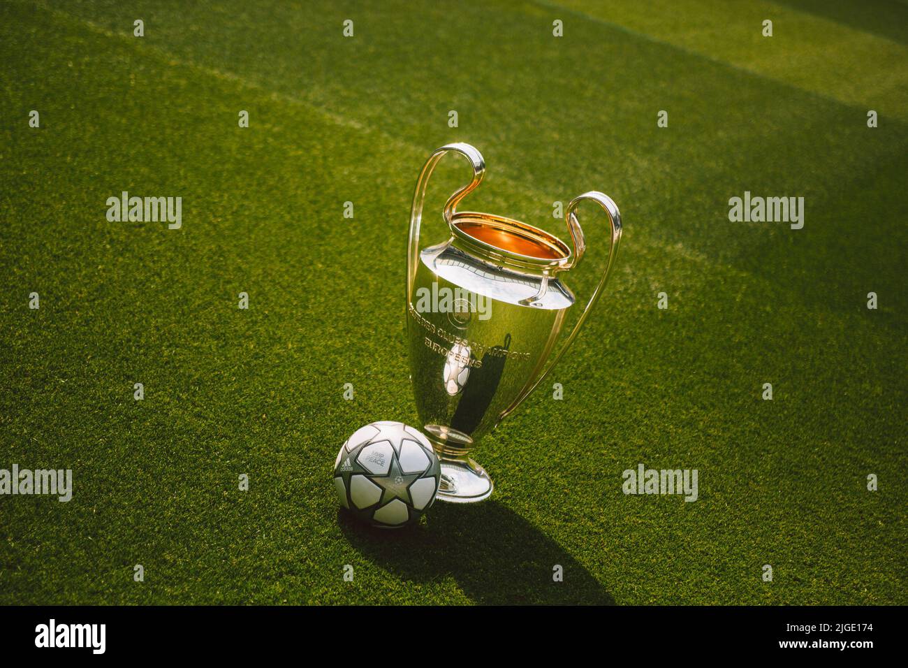 winner's trophy and official match ball by Adidas for the final of the UEFA  Champions League 2022 in Stade de France, Paris, France. inscribed with the  words 'мир | PEACE' Stock Photo - Alamy