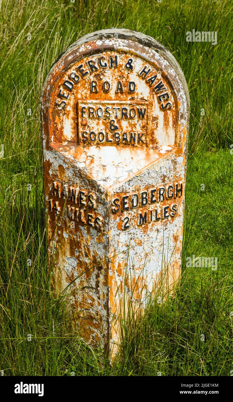 Directional Milestone on the roadside in Garsdale Cumbria Stock Photo