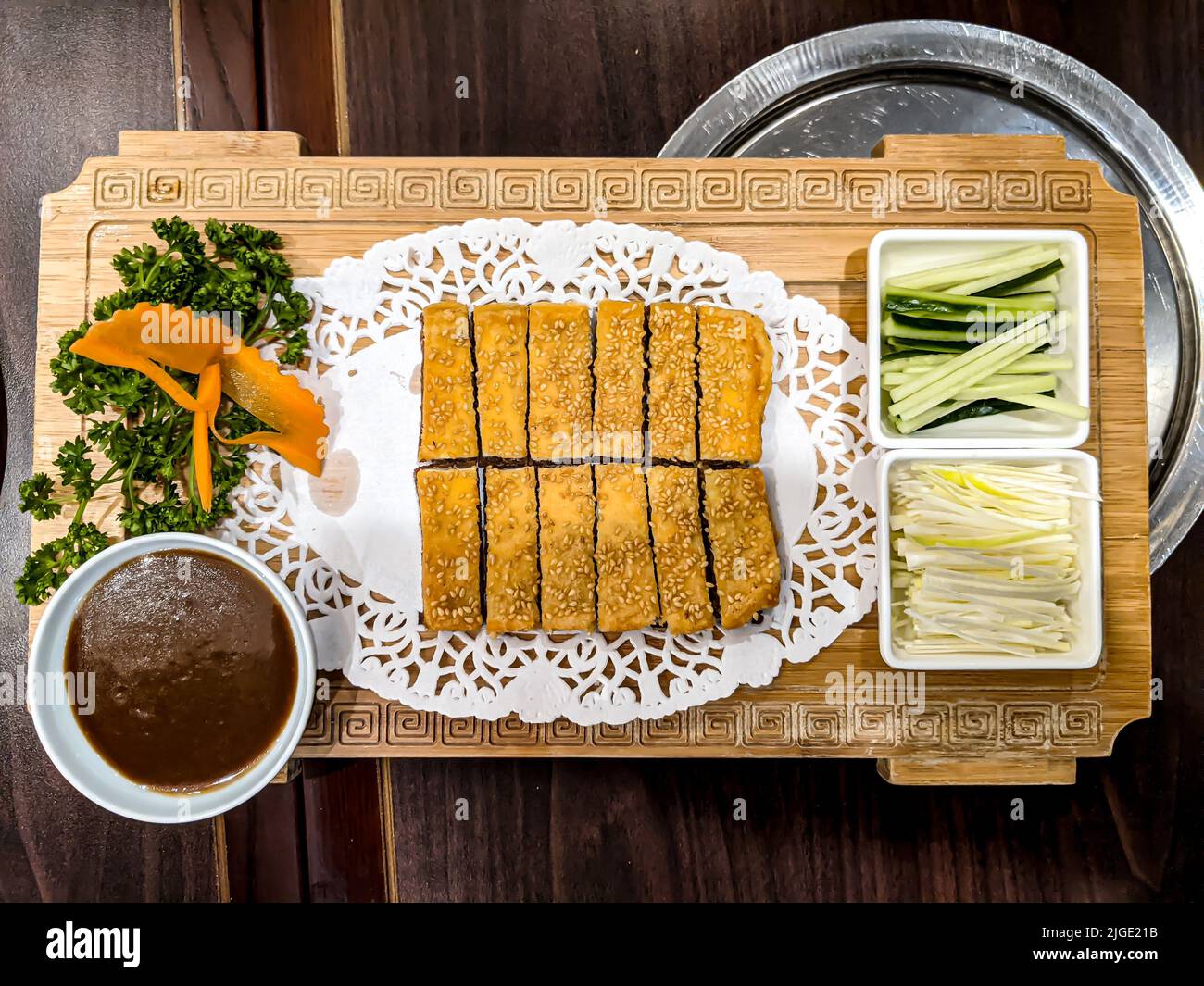 Fried duck in a Chinese restaurant with vegetables and sauce Stock