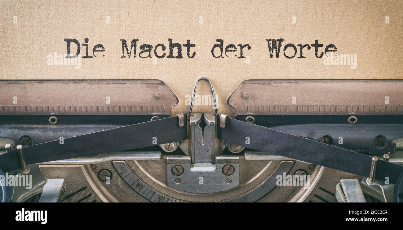 Text written with a vintage typewriter - The power of words in german - Die Macht der Worte Stock Photo