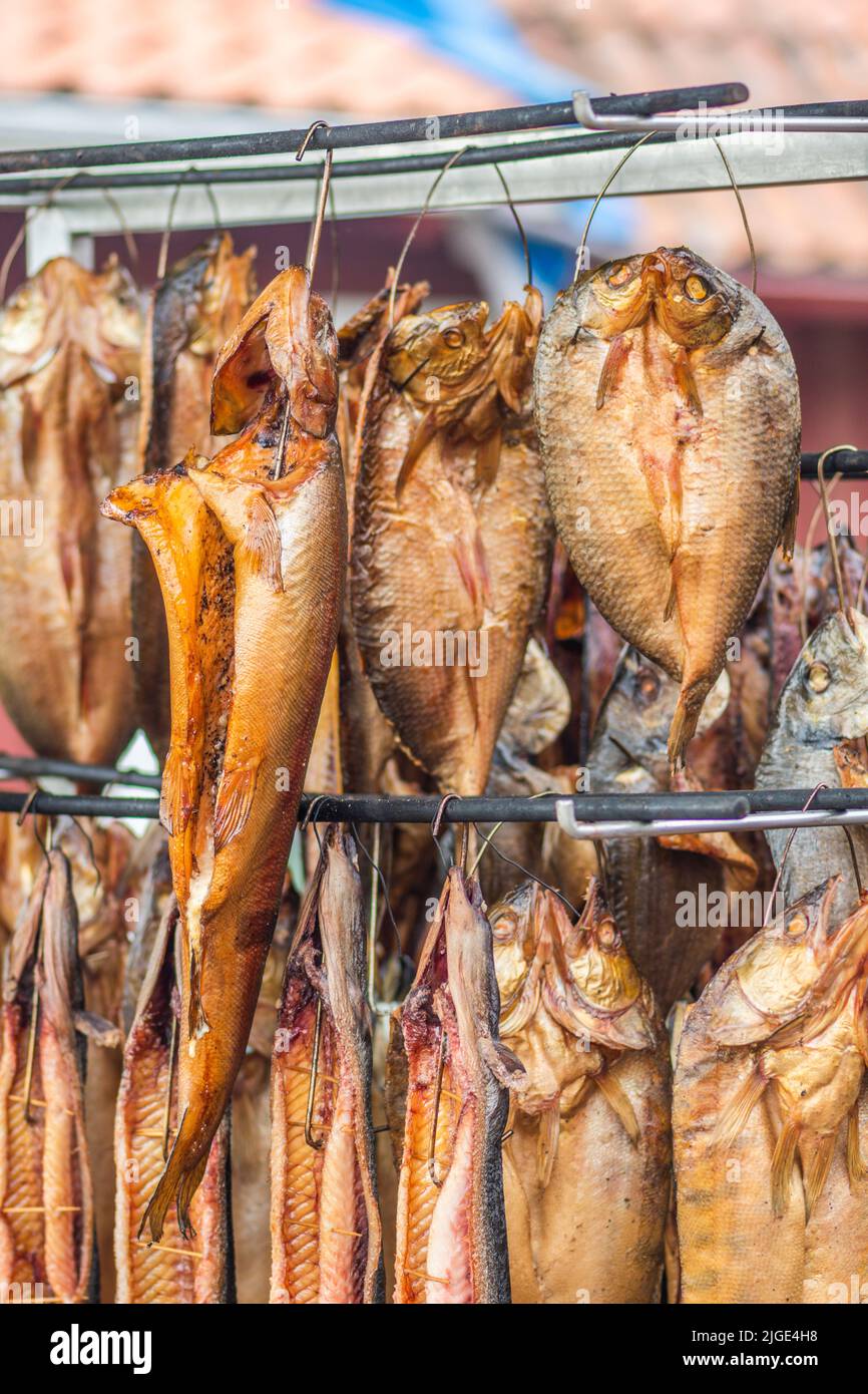 Hanging smokedried various fish in a fish market just smoked with