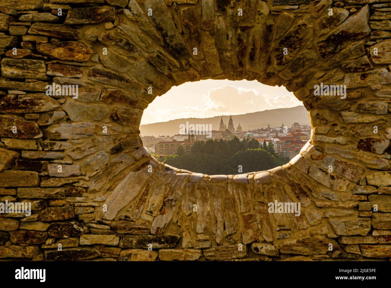 A view of an ancient city from a hole of a stone wall Stock Photo - Alamy
