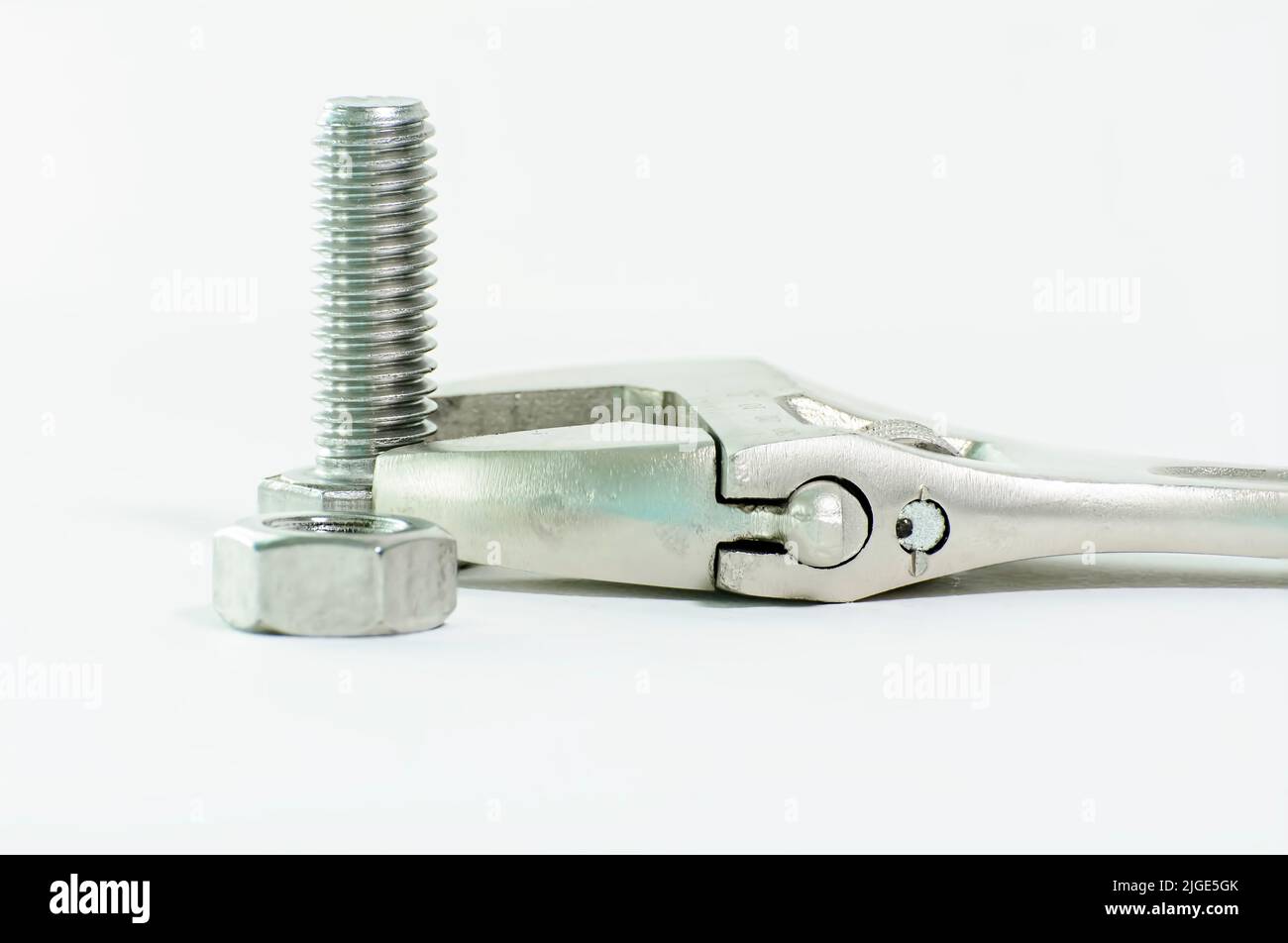 A closeup of wrench and hex bolt on a white background Stock Photo - Alamy