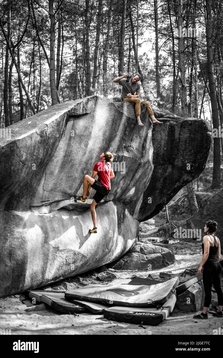 Jumping Hard Athletic young man is jumping for top hold in famous and hard dyno ...