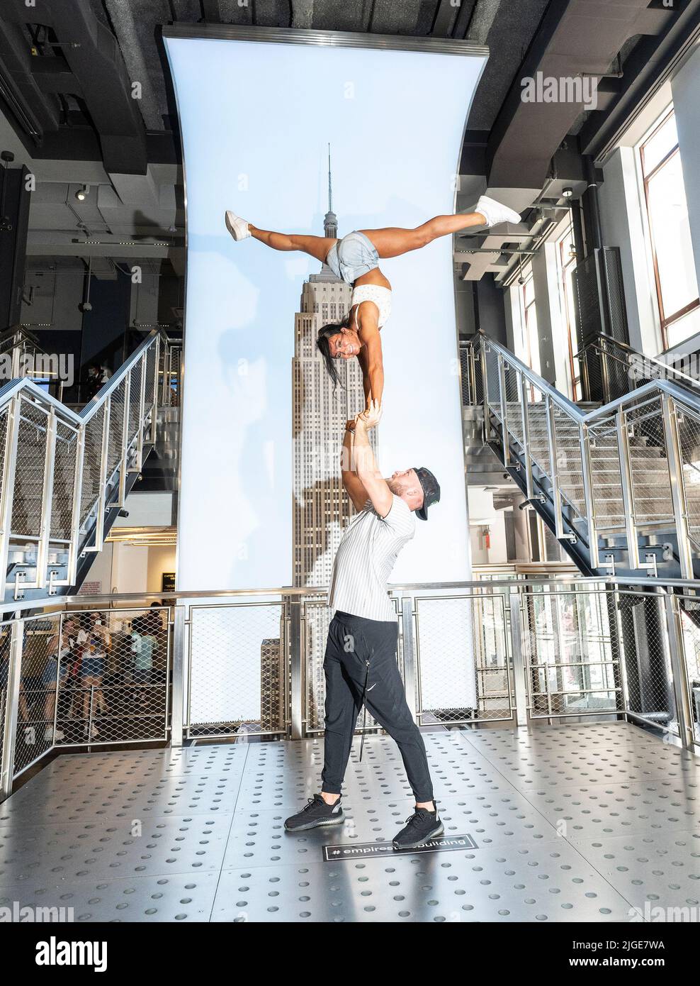 New York, United States. 09th July, 2022. Gabi Butler (on top) of the cast  of Netflix Docuseries Cheer performs on grand staircase of the Empire State  Building (Photo by Lev Radin/Pacific Press)