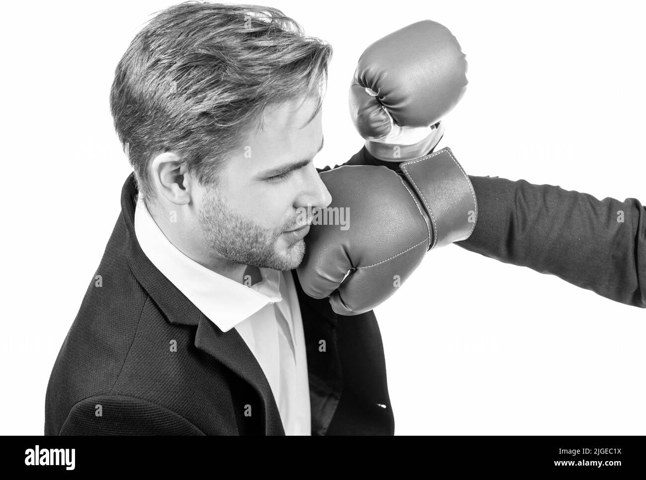 Young professional business man get punched in face with boxing glove isolated on white, looser
