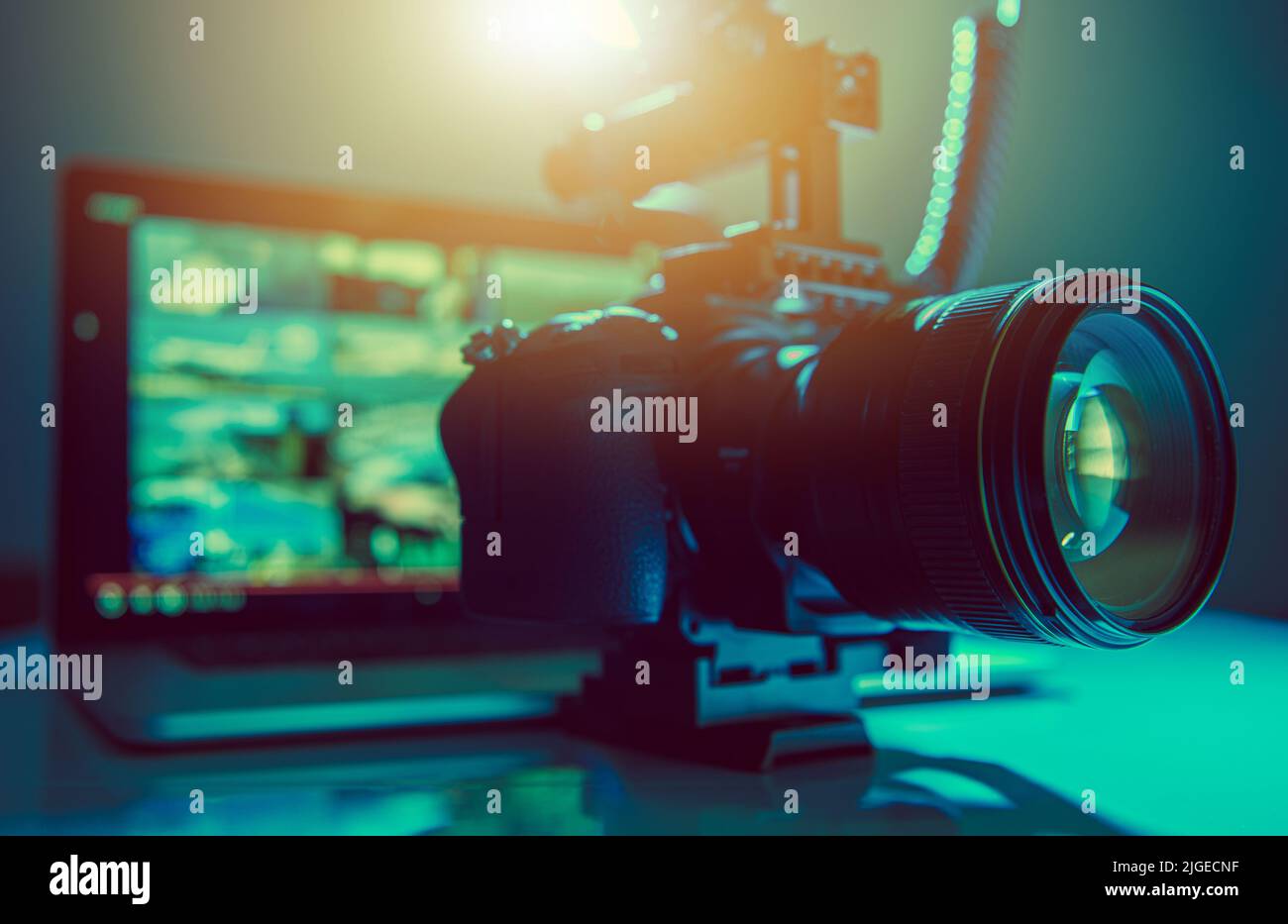 Digital Video Maker Equipment. Modern DSLR Camera and a Laptop