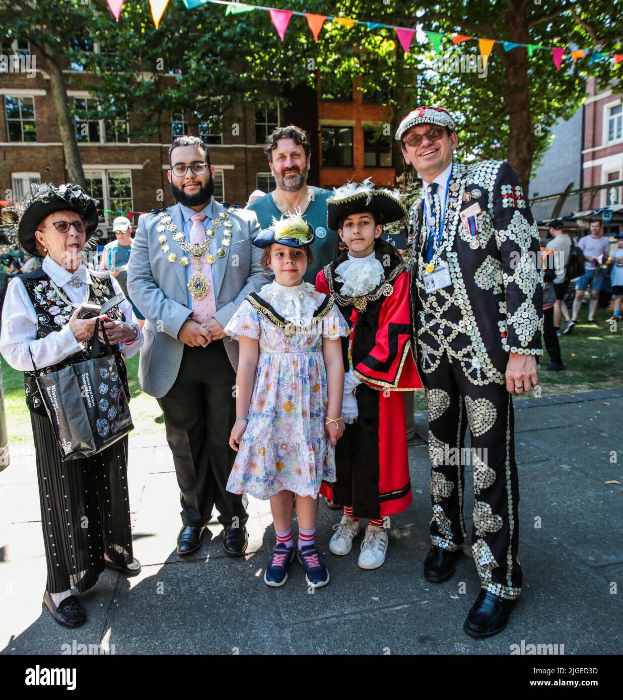 London UK 10 July 2022 CLLr Hamza Taouzzale, first muslim vote mayor for Westmisnter,with pearly Kings and queens and the two honorary soho mayors for the day at The 47th Soho Village Fete celebrated today ,with Spaghetti Eating Competition, The Soho Dog Show, Soho Police vs. Soho Fire Station Tug of War, Snail Racing plus food and drinks ,fun for all the family. Paul Quezada-Neiman/Alamy Live News Stock Photo