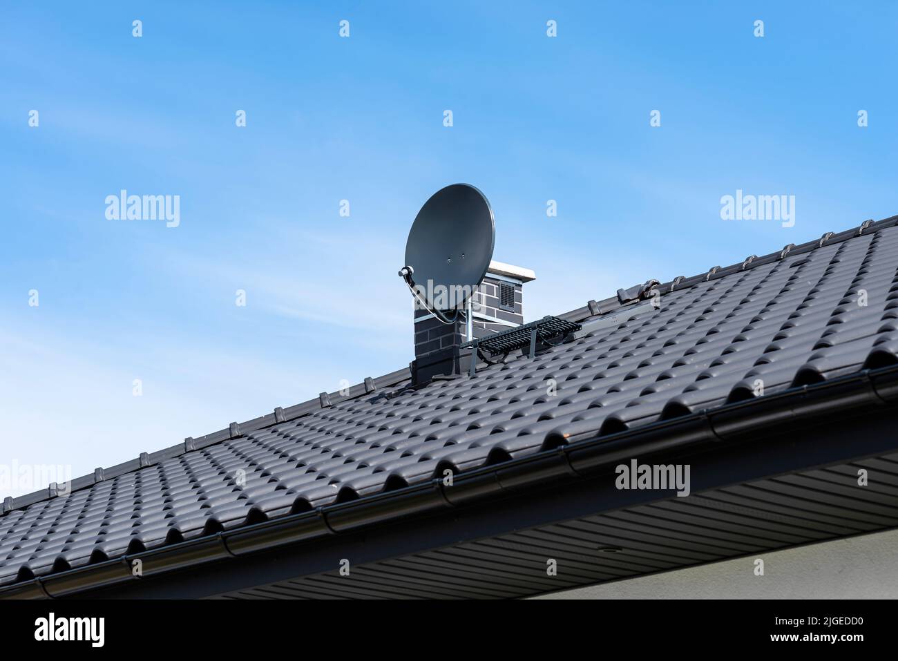 Graphite satellite dish mounted to the chimney with the chimney holder Stock Photo Alamy