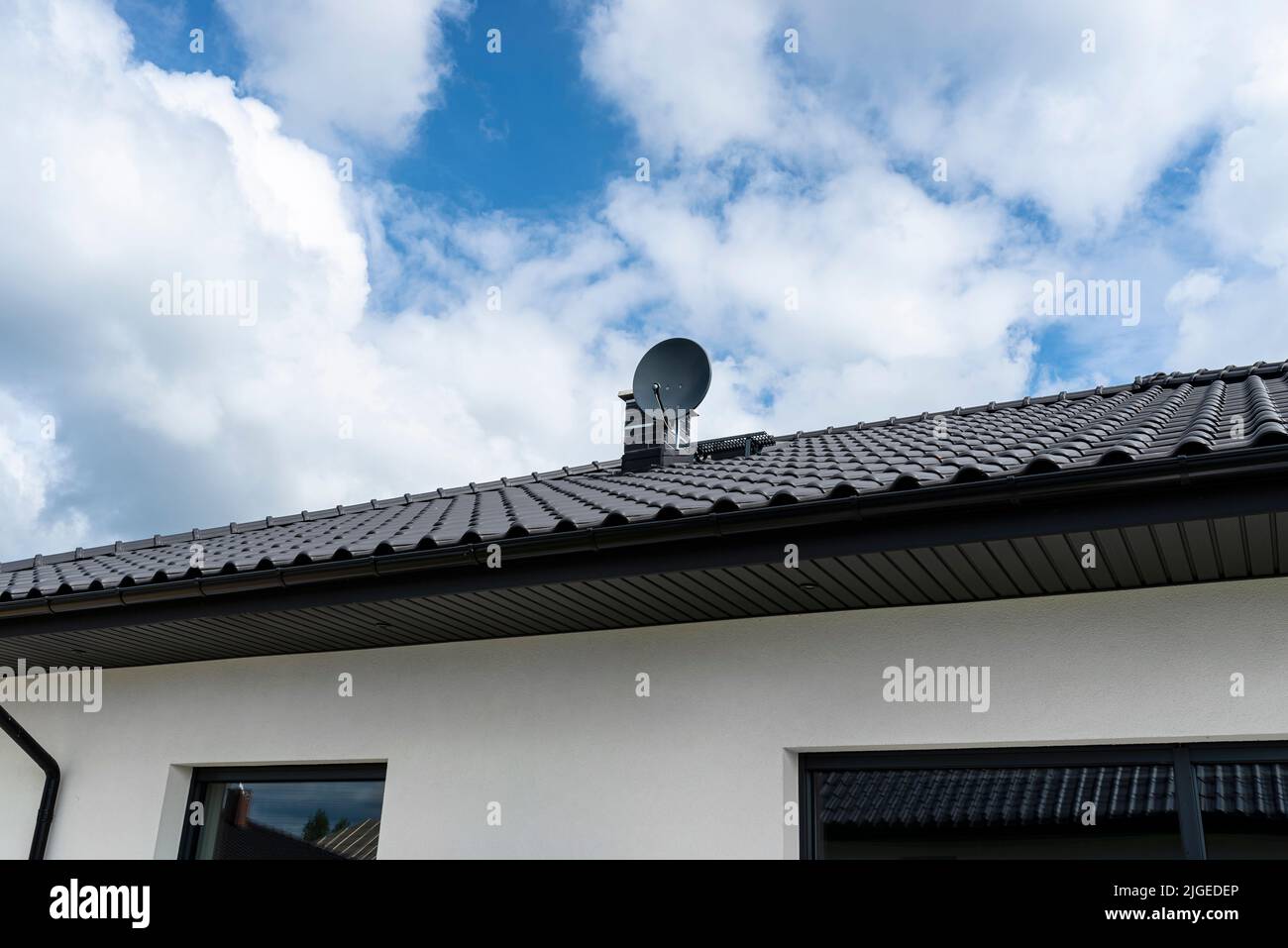 Graphite satellite dish mounted to the chimney with the chimney holder Stock Photo Alamy