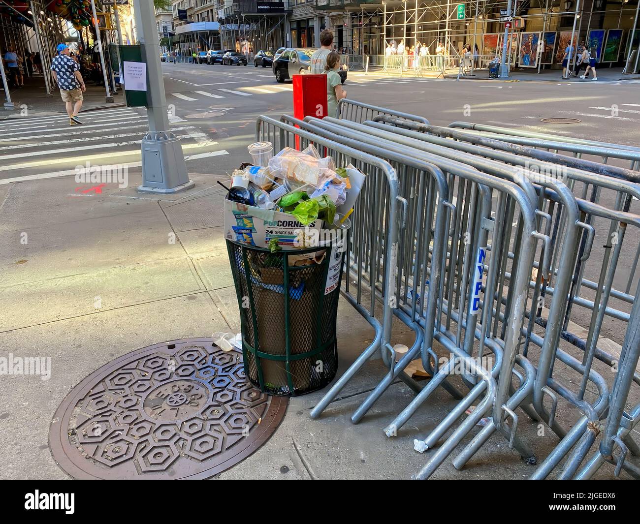 New York, NY, USA July 9, 2022 A trash can is filled to overflowing