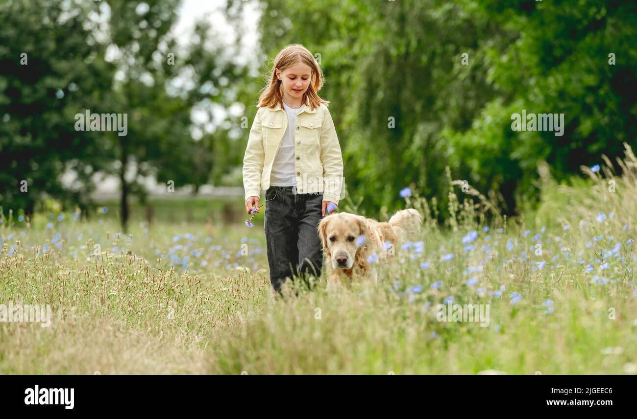 Girl with golden retriever dog Stock Photo - Alamy