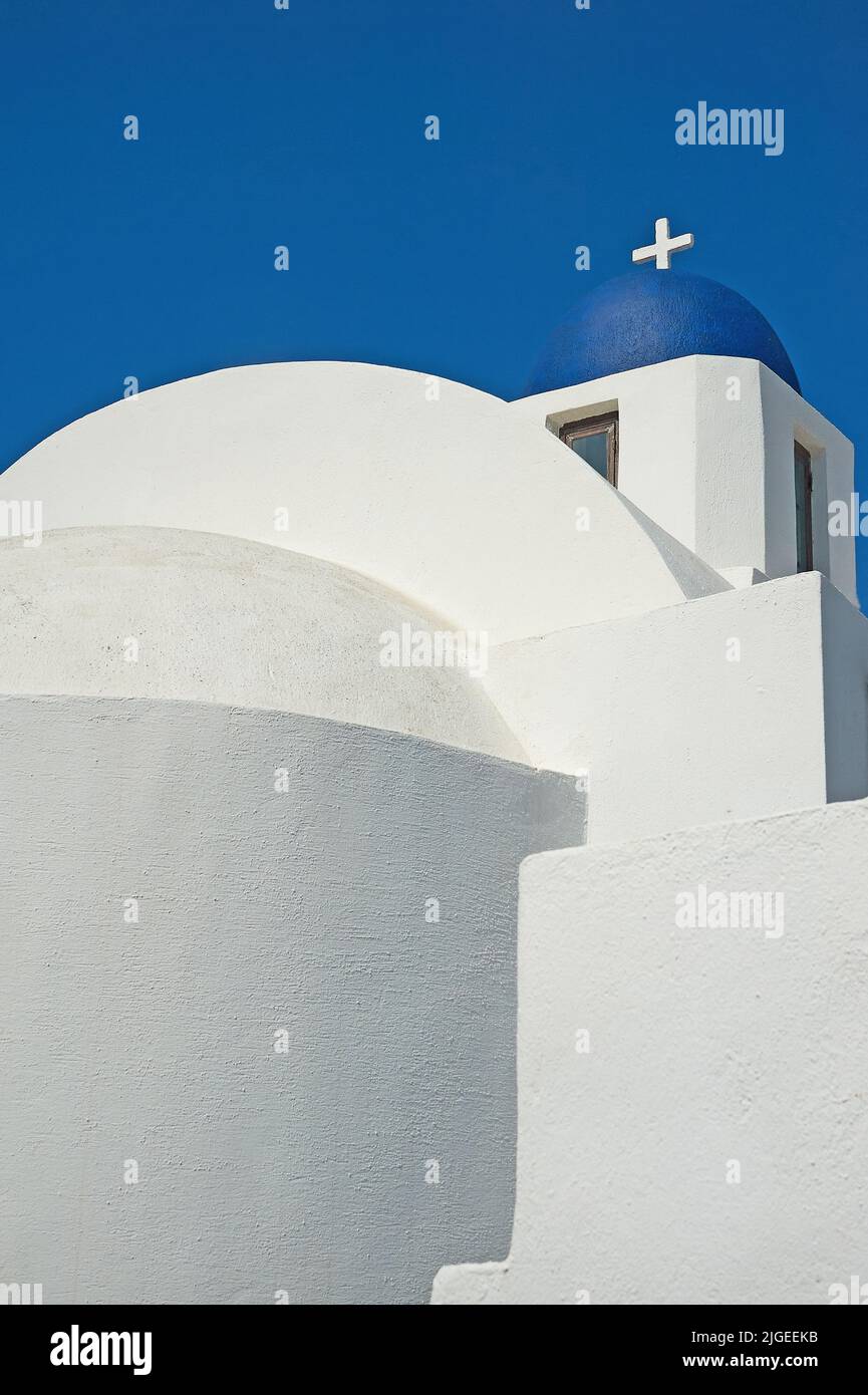 Typical white walled and blue domed church on the island of Santorini, Greece Stock Photo