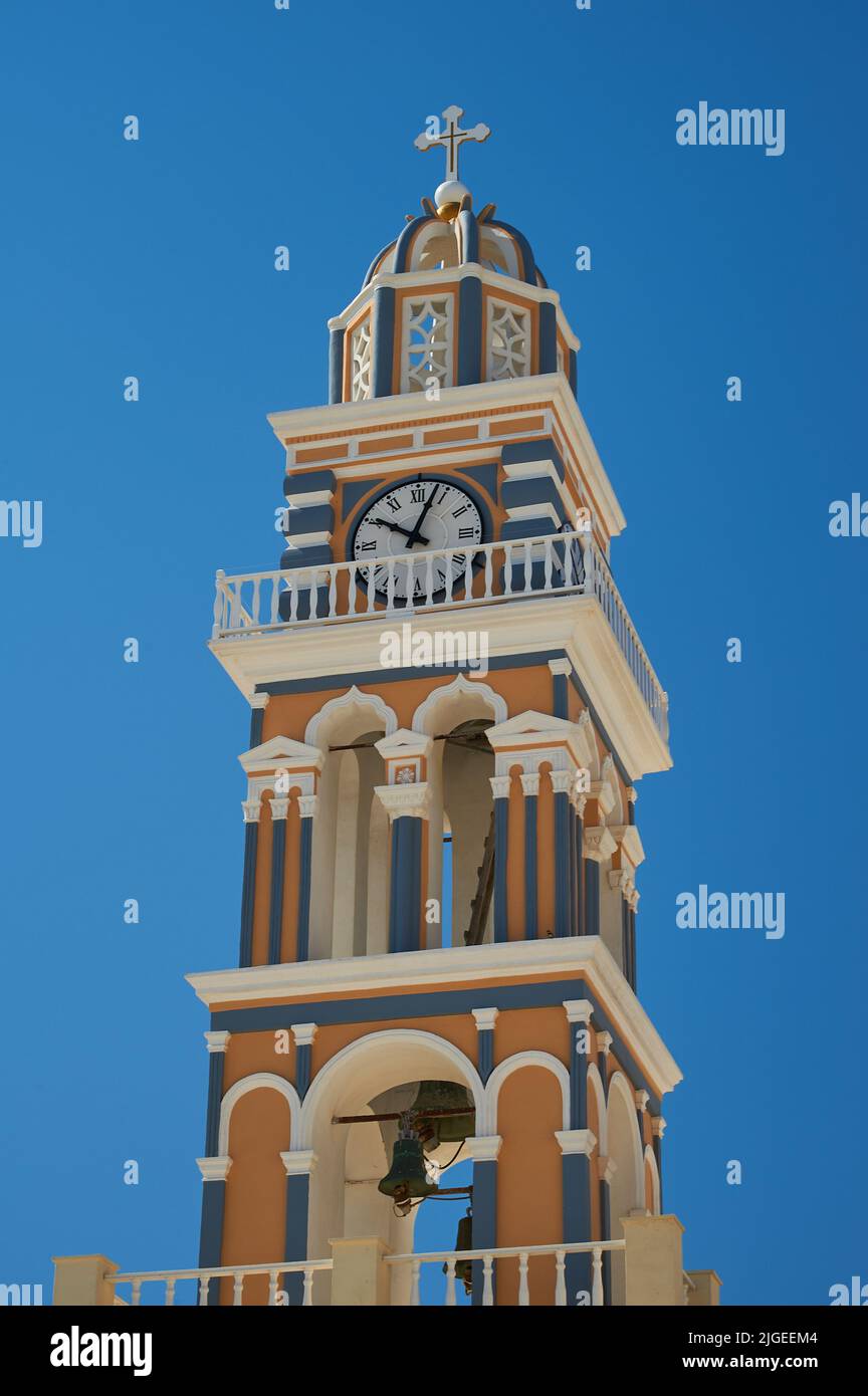 Ornate clock tower of St John the Baptist cathedral in Fira (Thira) on the island of Santorini, Greece Stock Photo