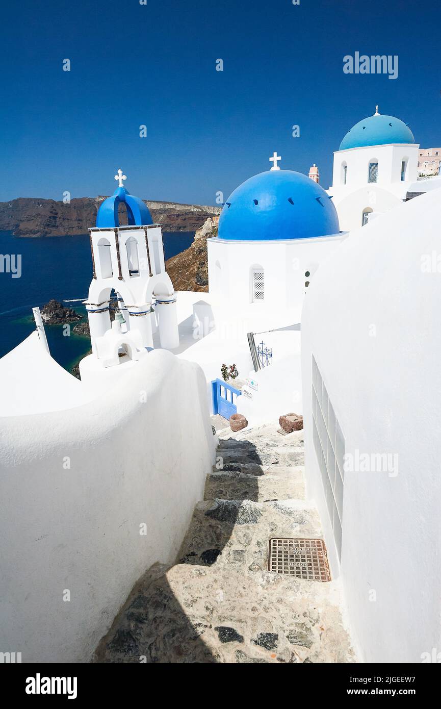 Oia, or Ia a picturesque village of white washed houses on the island of Santorini, part of the Cyclades Islands off mainland Greece Stock Photo