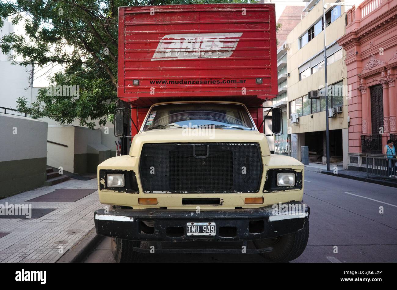 Buenos Aires, Argentina - January, 2020: Big old truck with beige cabin and red trailer. Old vintage lorry for cargo transportation Stock Photo