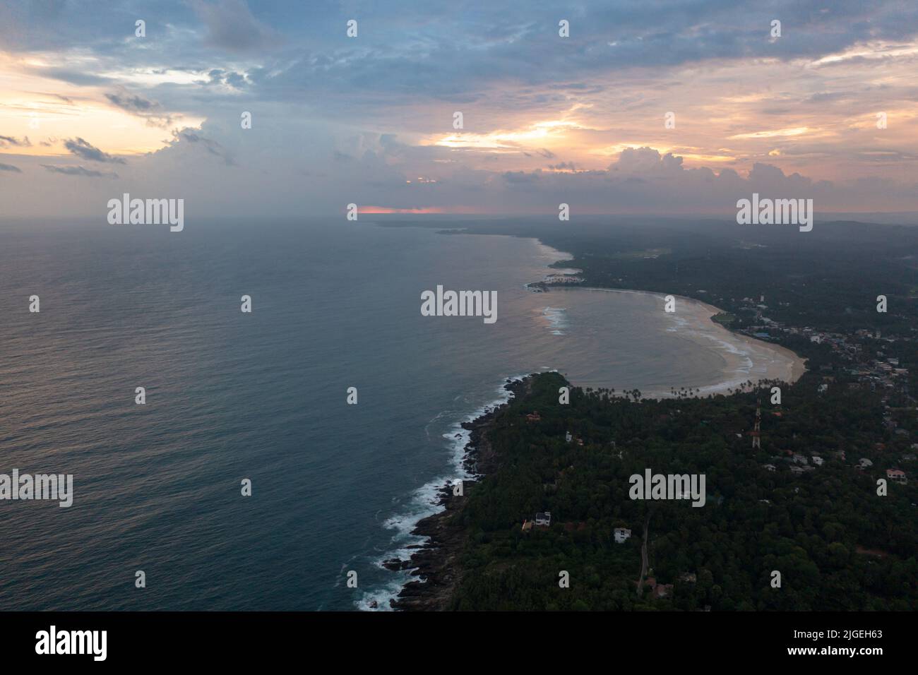 The beach and the ocean during sunset. Dickwella Beach, Sri Lanka. Stock Photo