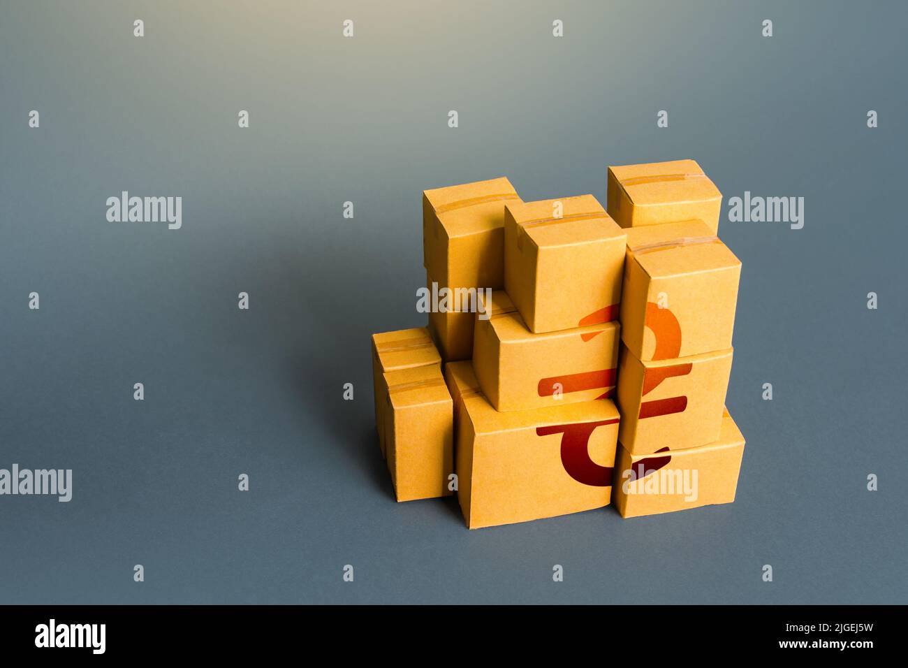 Boxes with ukrainian hryvnia symbol. Distribution of goods. Transportation logistics. Retail of products. Consumption economics, imports and exports. Stock Photo