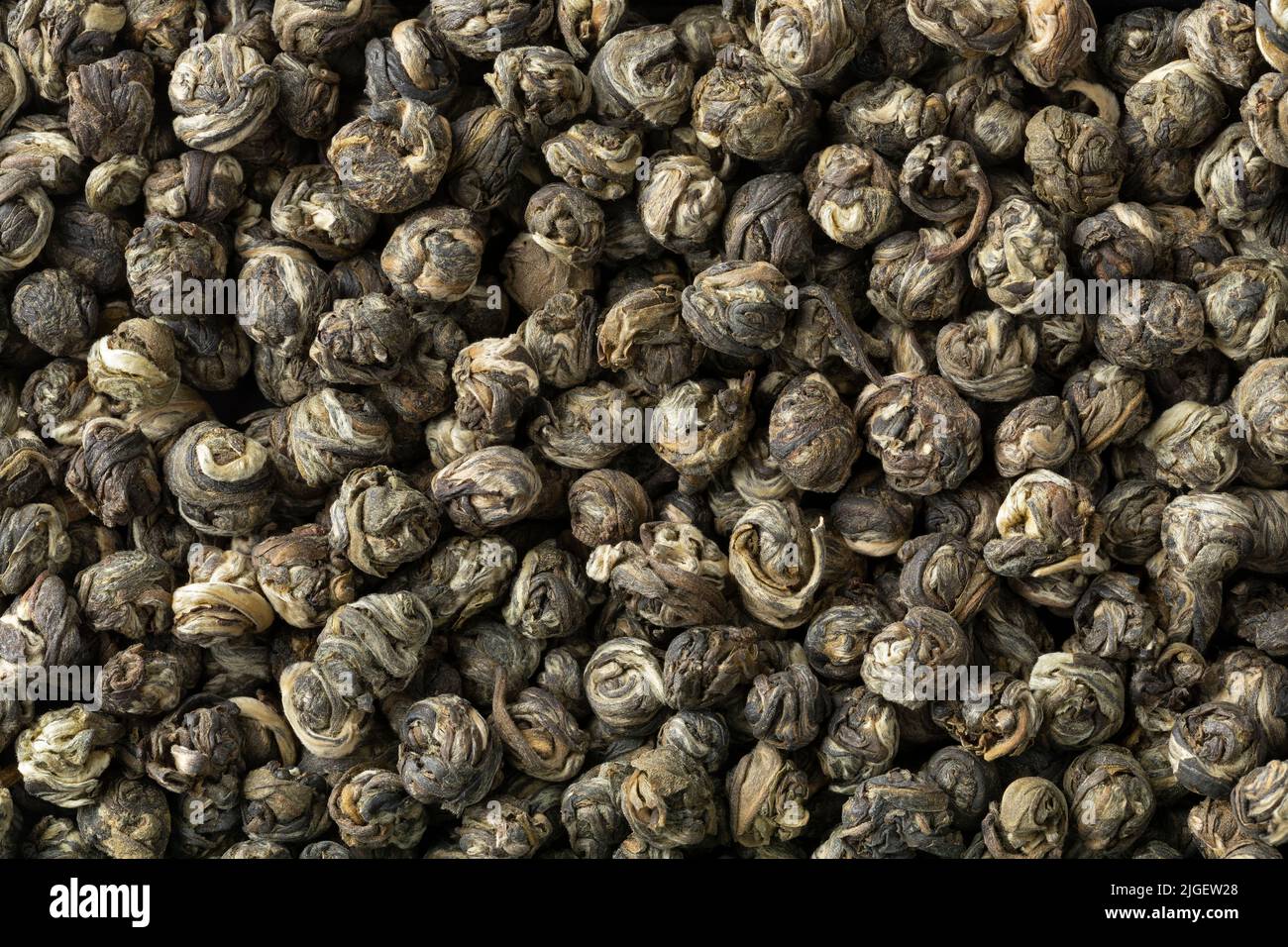 Chinese Jasmine Dragon pearl tea close up full frame as background Stock Photo