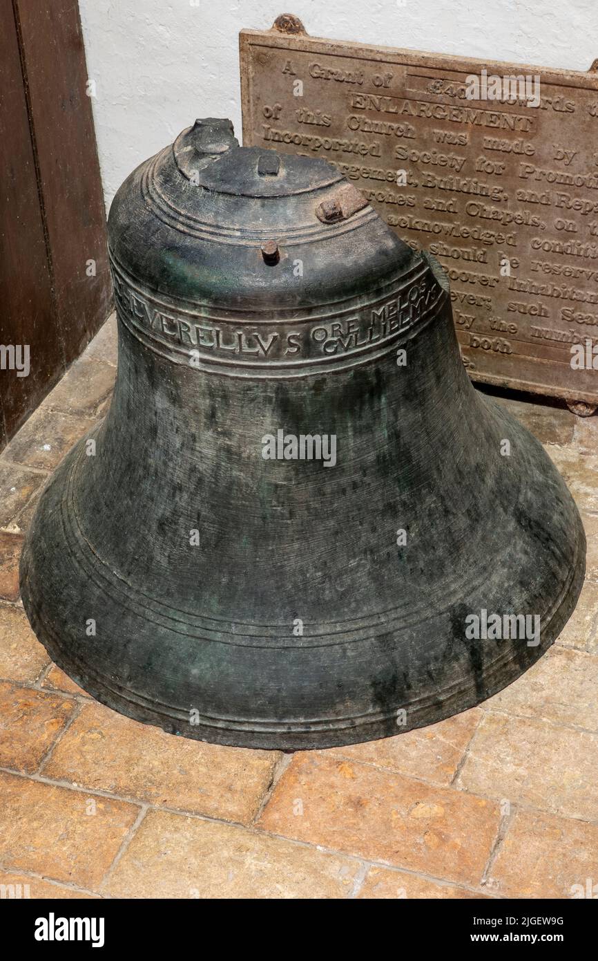 Damaged Treble bell in the porch of the Church of St Peter, Charsfield, Suffolk Stock Photo