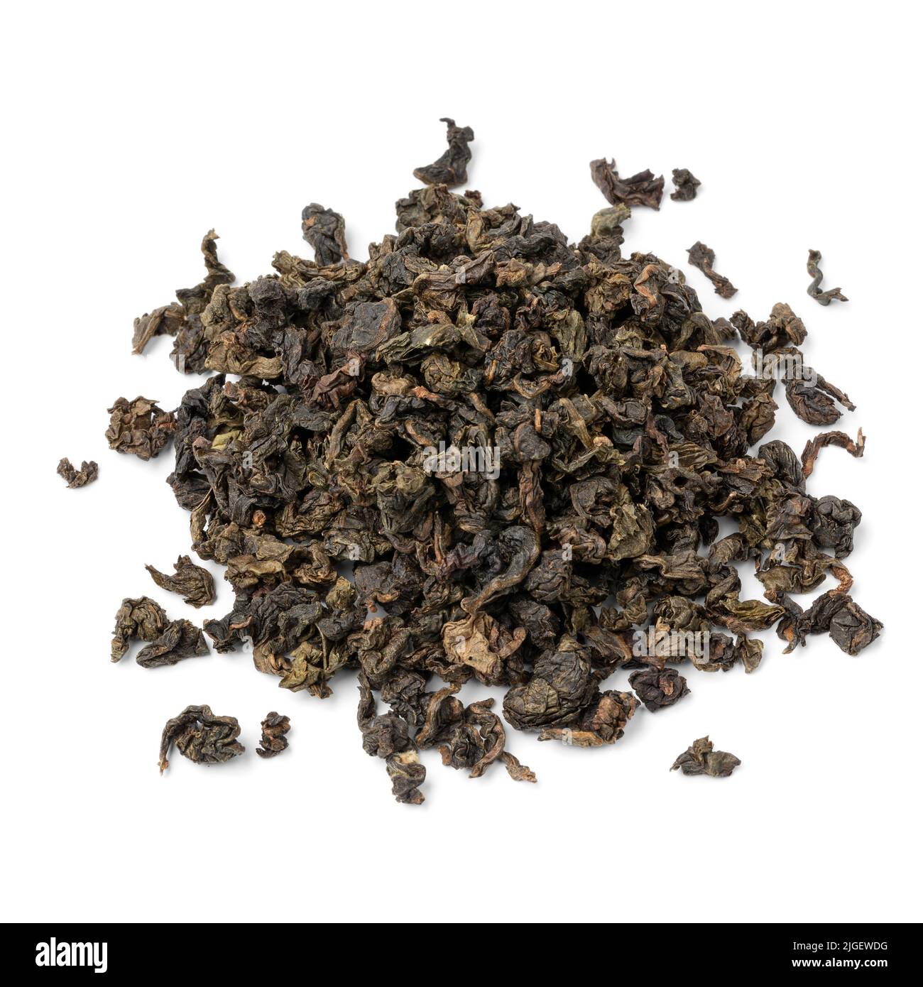 Heap of dried Chinese Oolong Se Chung tea leaves close up isolated on white background Stock Photo