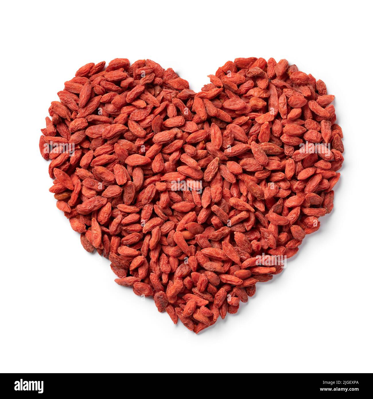 Dried goji berries in heart shape isolated on white background close up Stock Photo