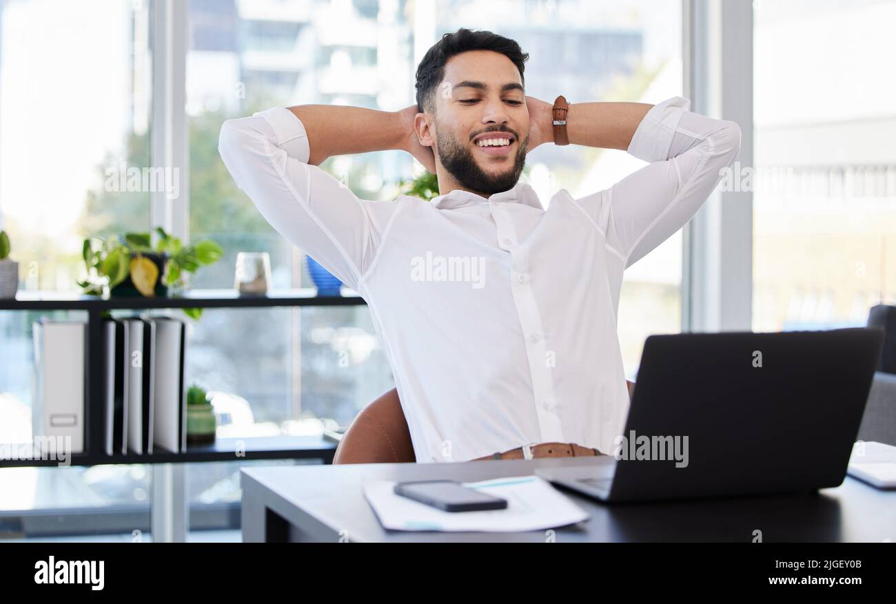 Taking pride in my accomplishments. a young businessman taking a break ...