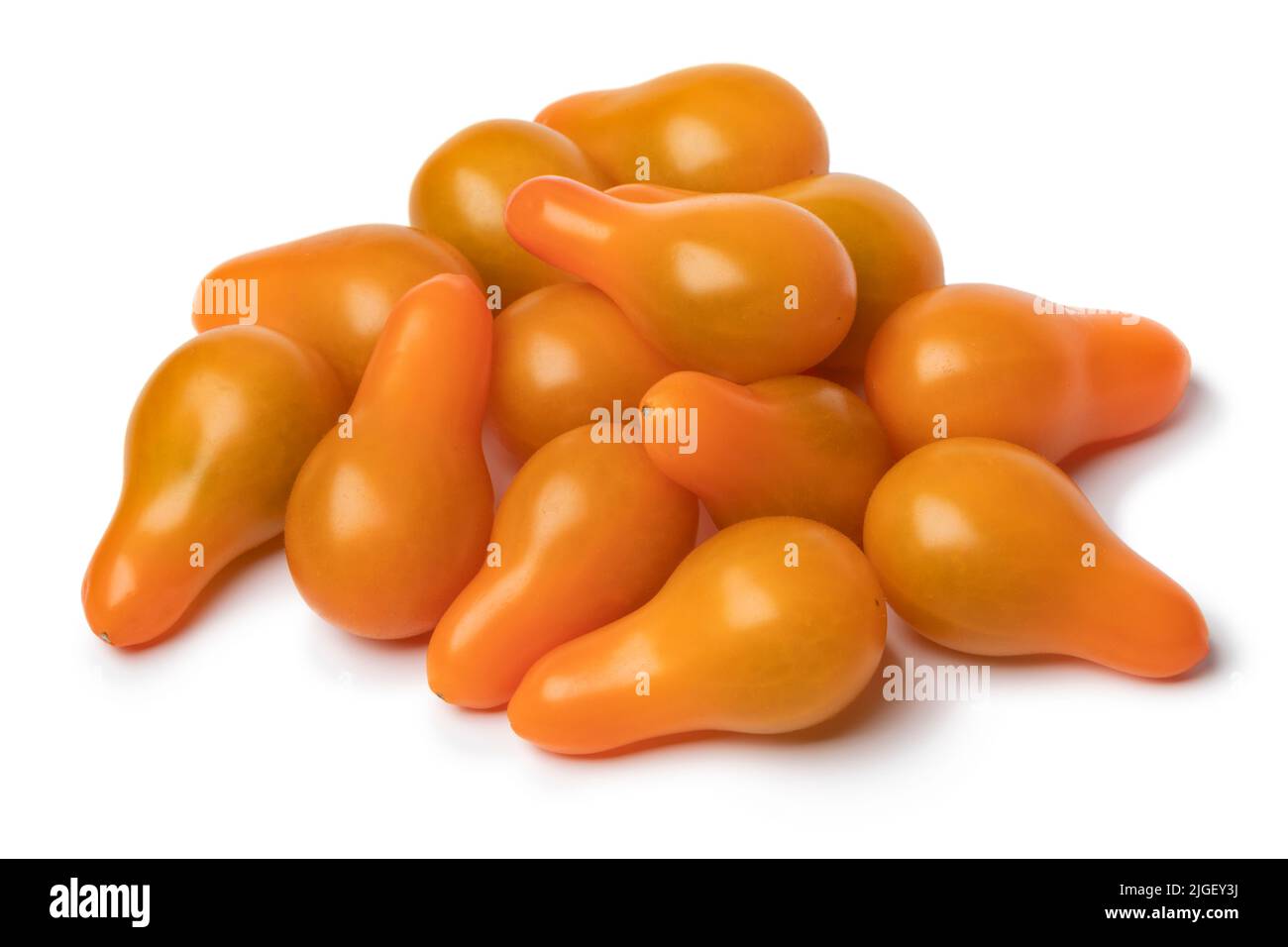 Heap of yellow whole pear tomatoes isolated on white background  close up Stock Photo