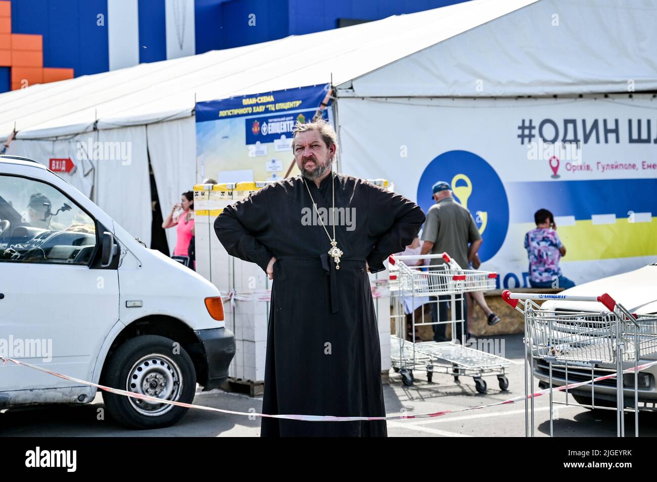 Non Exclusive: ZAPORIZHZHIA, UKRAINE - JULY 8, 2022 - A priest is pictured on the premises of the upgraded largest hub for internally displaced person Stock Photo