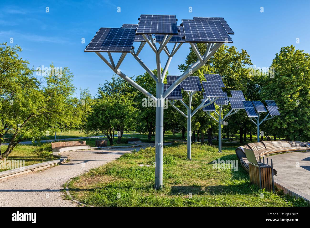 Solar panels on a stand in city park, photovoltaic modules, sustainable renewable energy source. Stock Photo