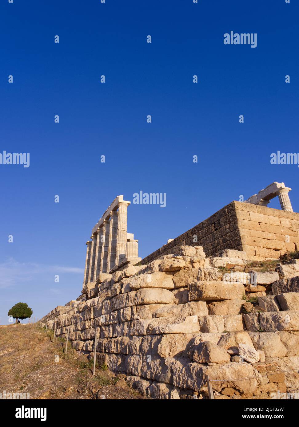Ancient Temple of Poseidon during sunset at Sounio, Greece Stock Photo