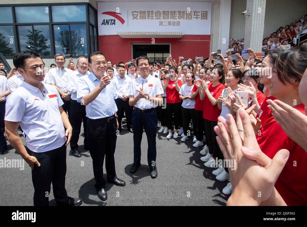 Fuzhou, China's Fujian Province. 8th July, 2022. Chinese Premier Li Keqiang, also a member of the Standing Committee of the Political Bureau of the Communist Party of China Central Committee, talks with employees of ANTA Sports, a large-scale private sportswear company, in southeast China's Fujian Province, July 8, 2022. Li made an inspection tour in Fujian Province from Thursday to Friday. Credit: Li Tao/Xinhua/Alamy Live News Stock Photo