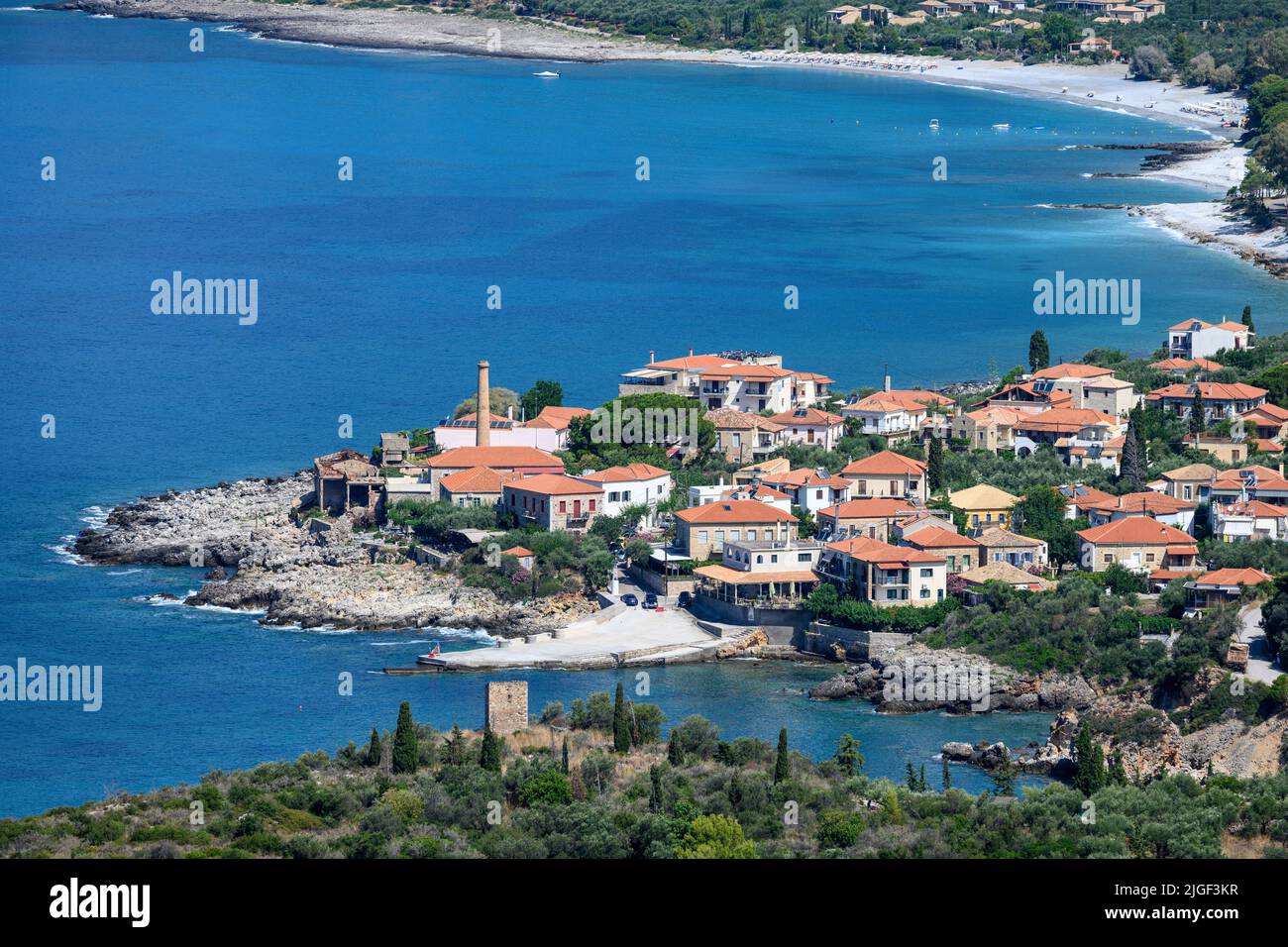 Looking down on the coastal village of Kardamyli with its bech in the background, in the outer Mani, Southern Peloponnese, Messinia, Greece. Stock Photo