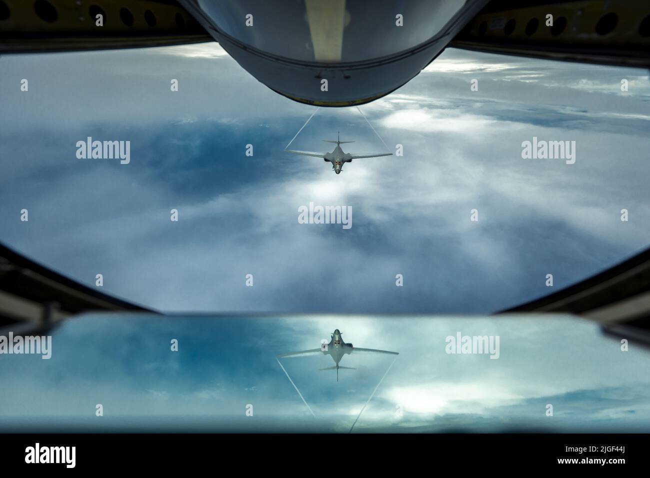 A U.S. Air Force B-1B Lancer, assigned to 34th Expeditionary Bomb Squadron, flies behind a U.S. Air Force KC-135 Stratotanker, assigned to 506th Expeditionary Air Refueling Squadron, during a Bomber Task Force mission over the Pacific Ocean, on Saturday, June 25, 2022. Bomber Task Force missions provide opportunities to train alongside our allies and partners to build interoperability and bolster our collective ability to support a free and open Indo-Pacific. Photo by Master Sgt. Nicholas Priest/U.S. Air Force/UPI Credit: UPI/Alamy Live News Stock Photo