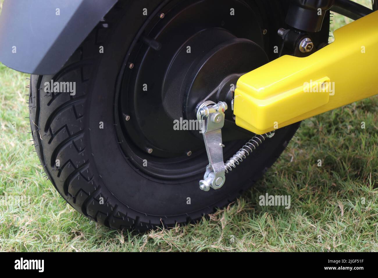 Ebike or electric scooter for daily commute view of its rear wheel along with its braking system Stock Photo