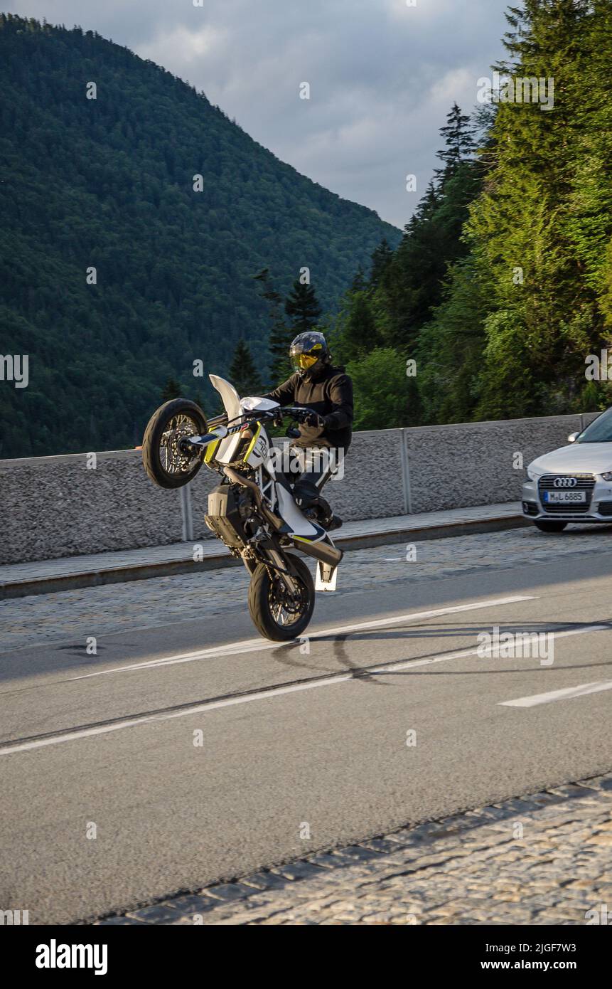 Performing Clutch Wheelies on a Motorcycle Stock Photo