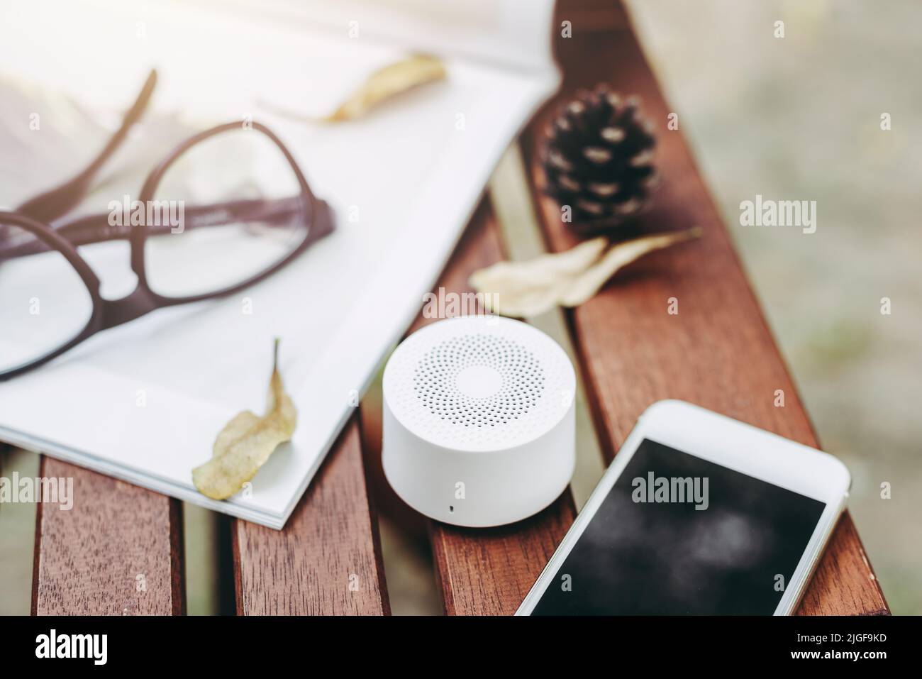 mini wireless portable bluetooth speaker for music listening. Voice assistant speaker at home. Stock Photo