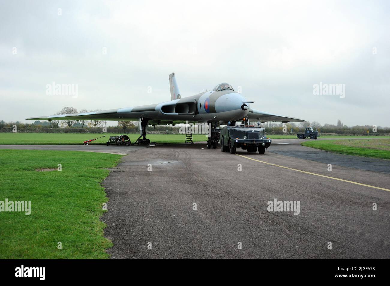 XM655 and Aircraft Tug at Wellesbourne Airfield. Stock Photo