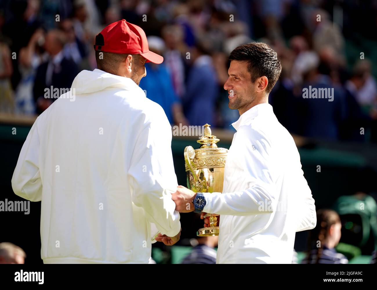 Wimbledon Champion Novak Djokovic with his trophy alongside runner up
