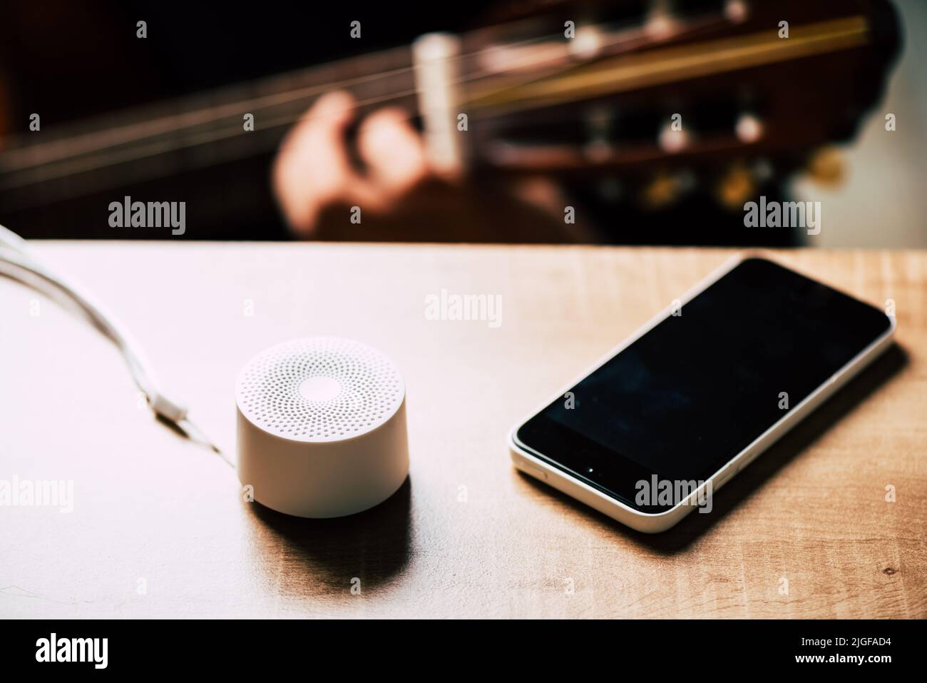 mini wireless portable bluetooth speaker for music listening. Voice assistant speaker at home. Stock Photo
